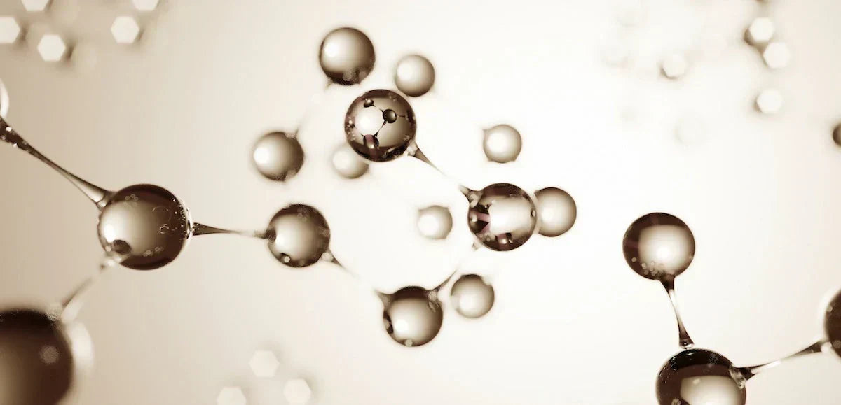 Molecular structure model with atoms on a beige background