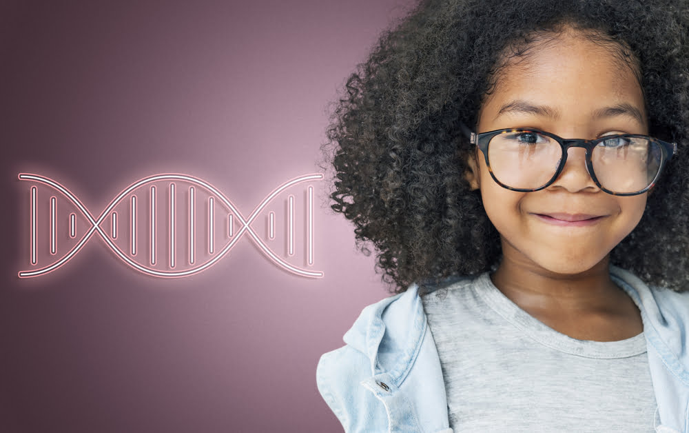 Smiling young girl with curly hair and glasses standing next to a glowing DNA double helix illustration, symbolizing genetics.