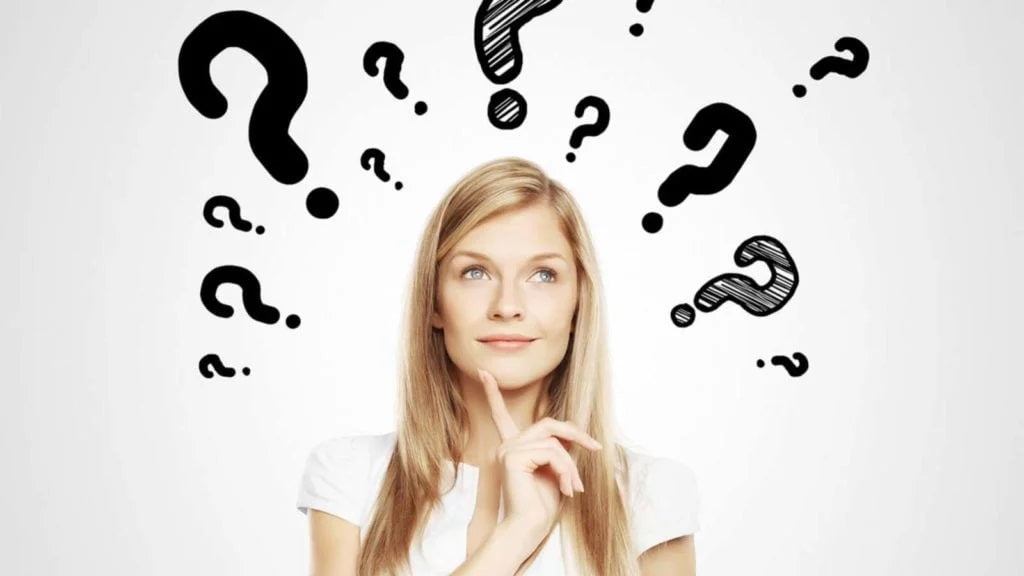 A thoughtful woman with a questioning expression surrounded by hand-drawn question marks and a few exclamation points.
