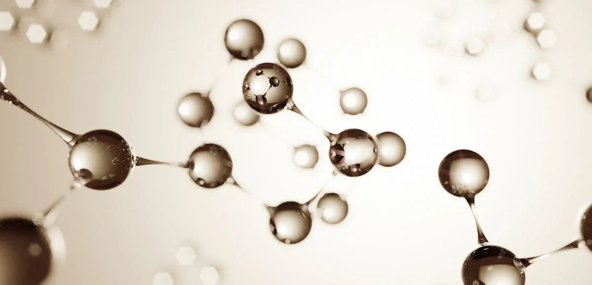 Molecular structure model with atoms on a beige background